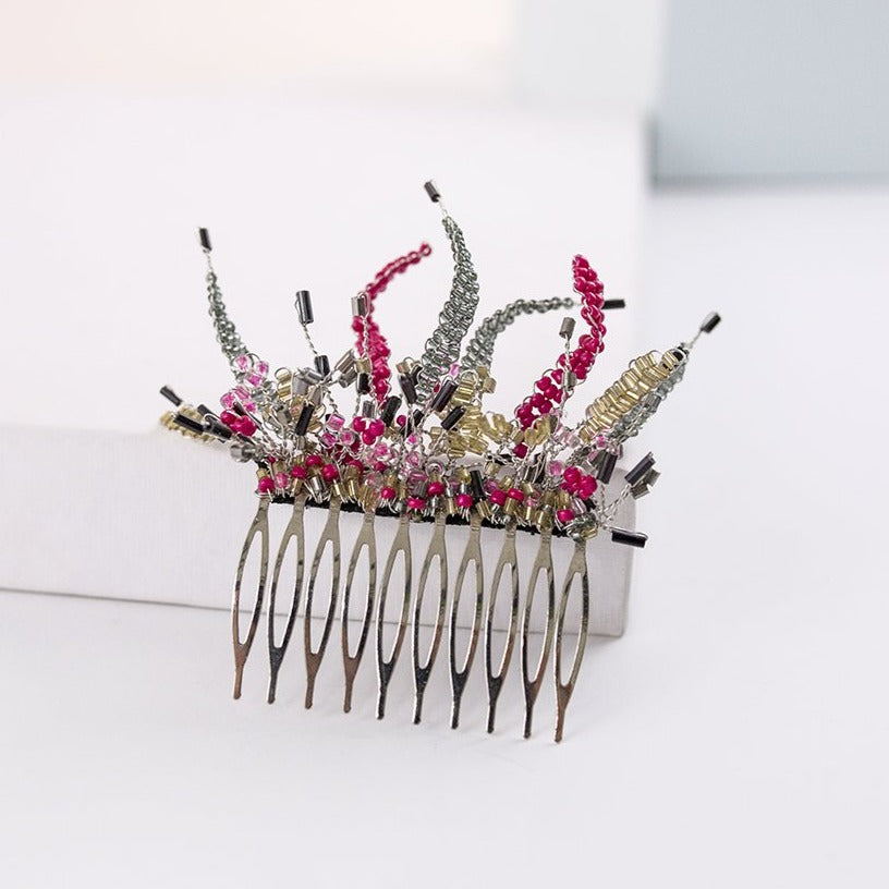 Alquiler de tocado peineta Joya fucsia