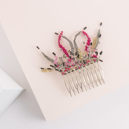 Alquiler de tocado peineta Joya fucsia