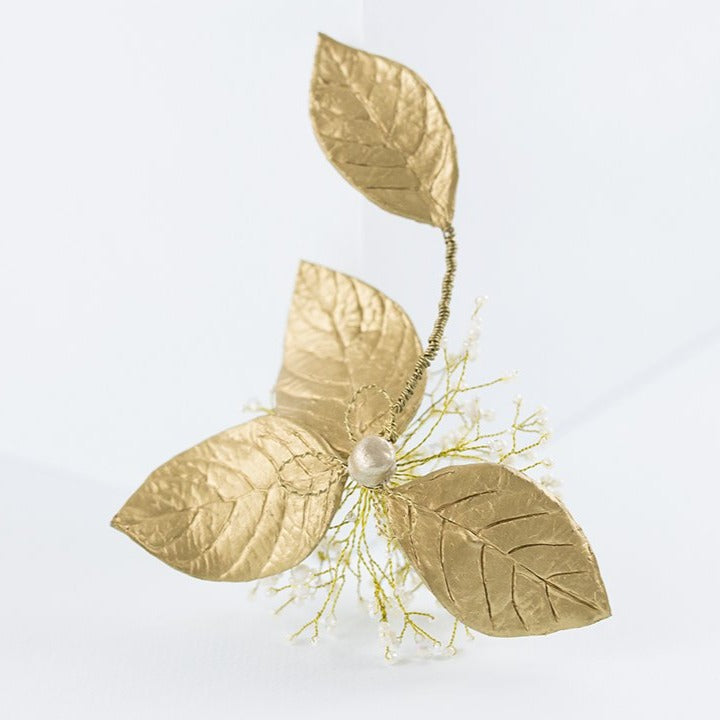 Tocado de porcelana flor aguacate dorado