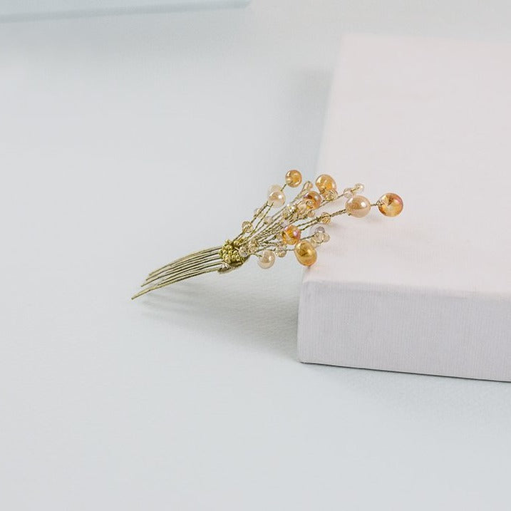 Peineta pequeña de piedras oro y crema