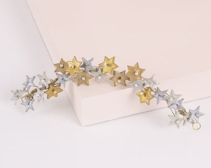 Tocado de porcelana estrellas oro y plata