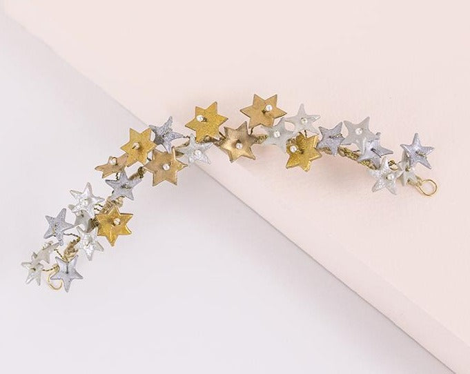 Tocado de porcelana estrellas oro y plata